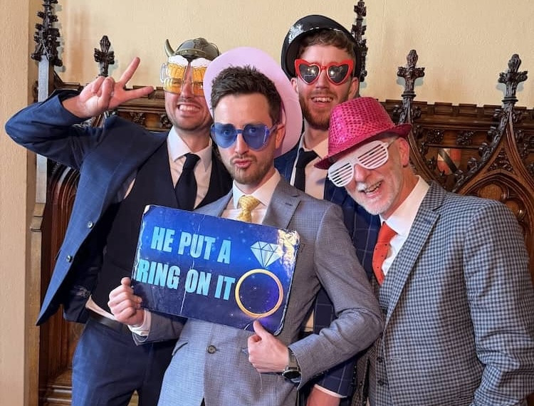 Group of wedding guests using the Magic Mirror at Allerton Castle
