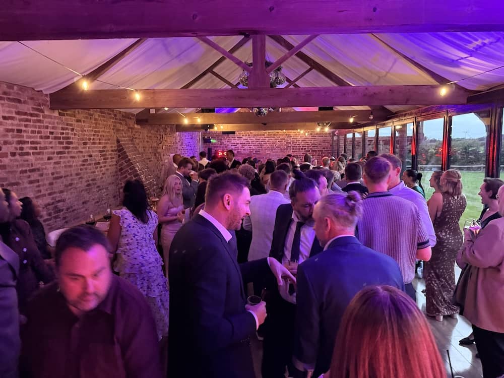 Packed evening wedding reception at Camblesforth Hall