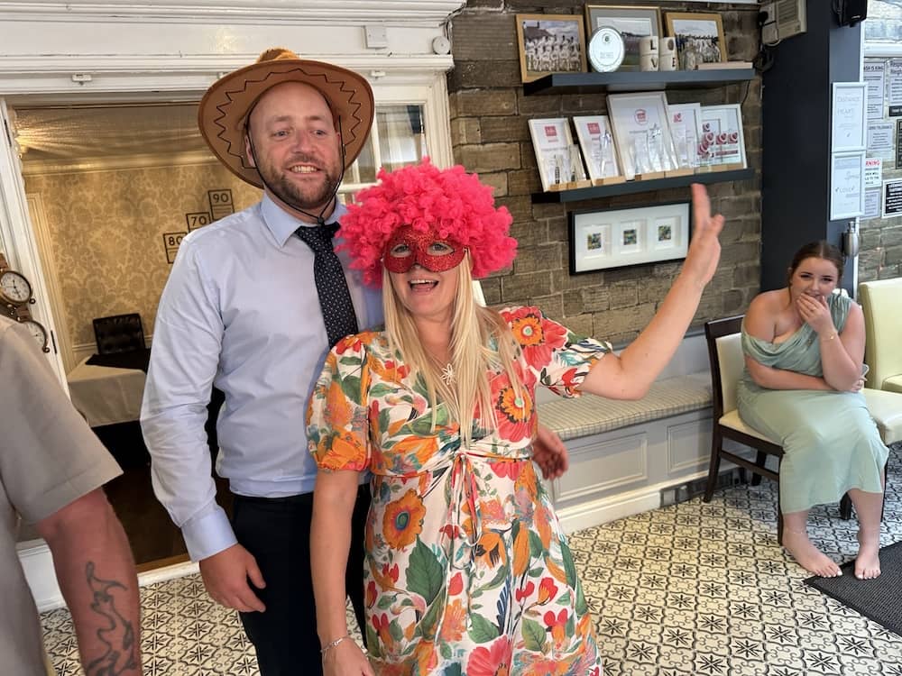 Wedding guests using Magic Mirror props at Dimplewell Lodge