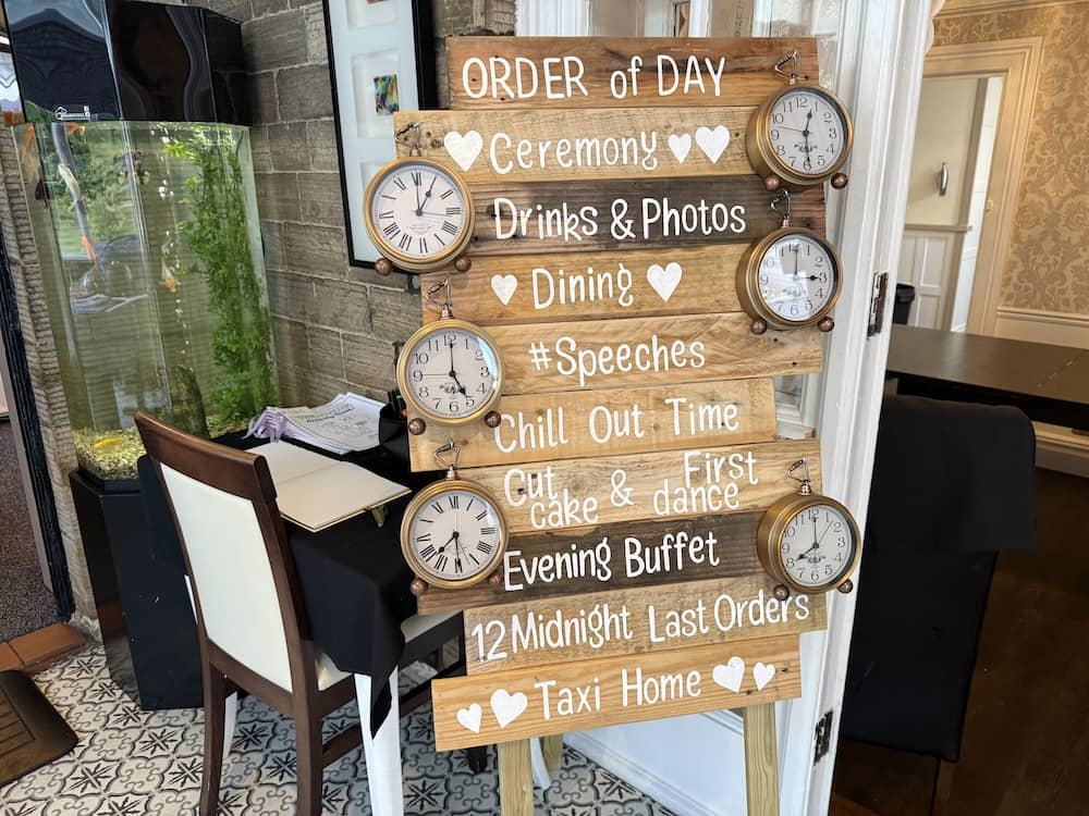 Order of the day sign at Dimplewell Lodge wedding