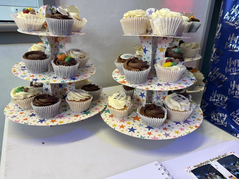 Birthday cupcakes prepared for John's surprise party