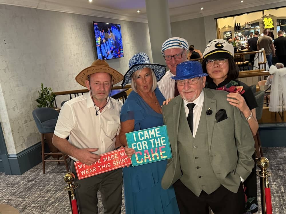 Guests posing with Magic Mirror props at Fairfield Manor wedding
