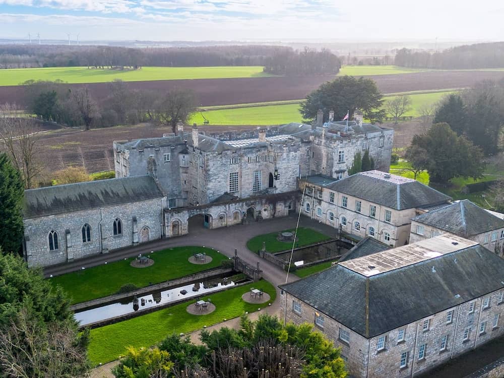 Drone portrait shot of Hazlewood Castle wedding venue