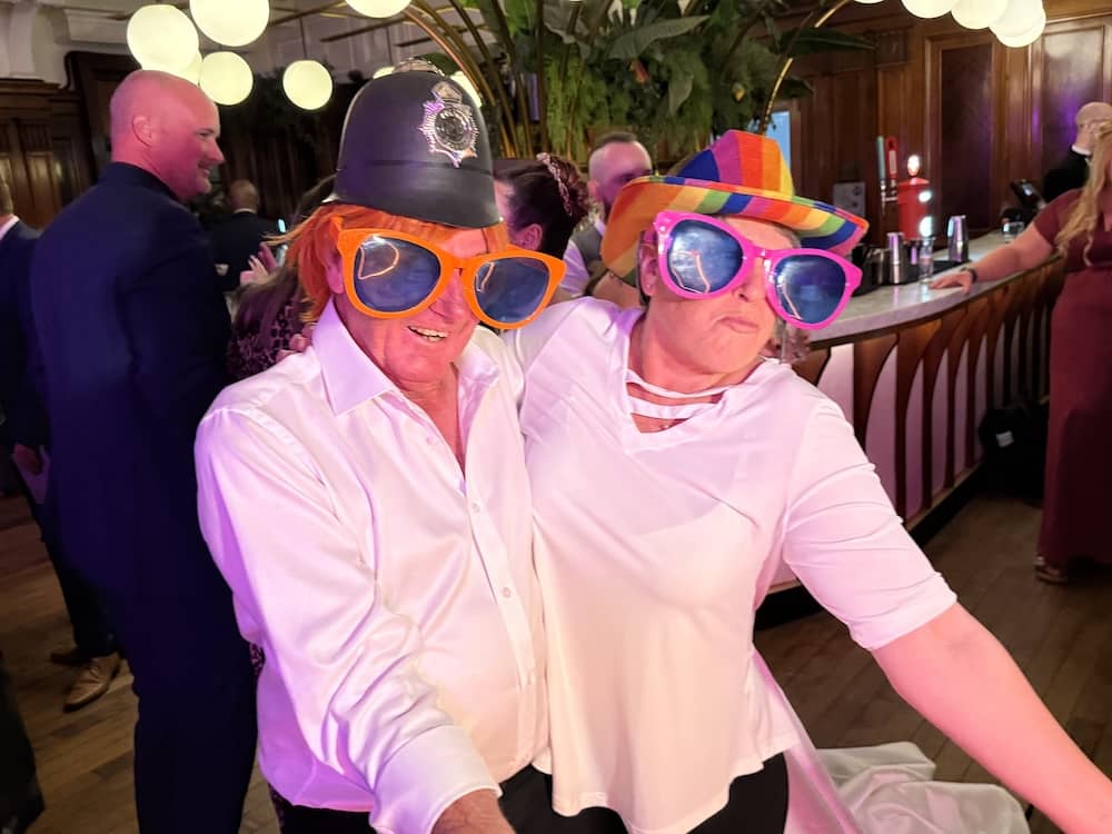 Wedding guests wearing oversized glasses at the Magic Mirror