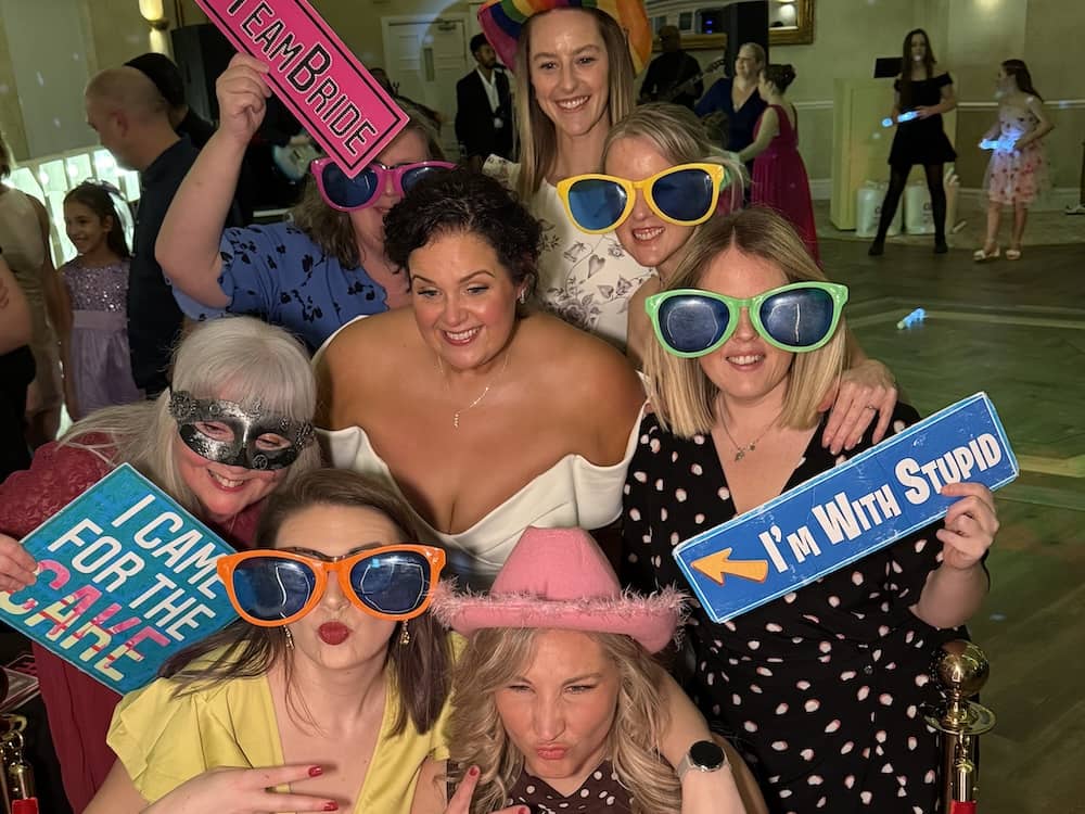 Wedding guests of all ages enjoying the Magic Mirror
