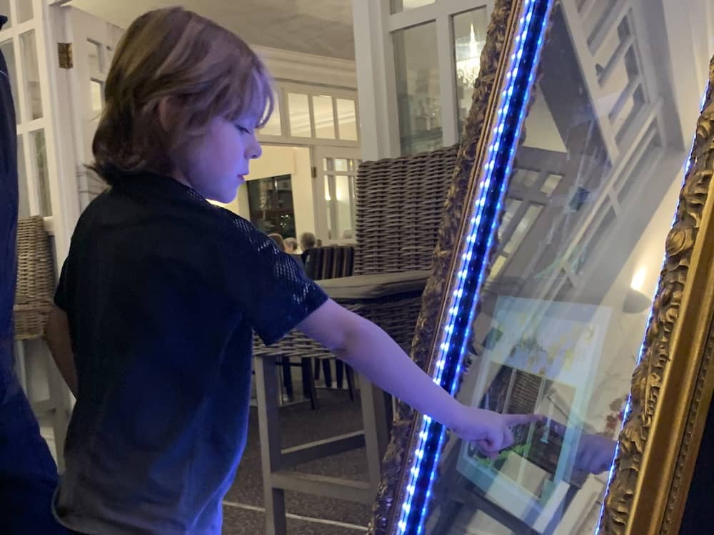 Guest interacting with the Yorkshire Magic Mirror for the first time