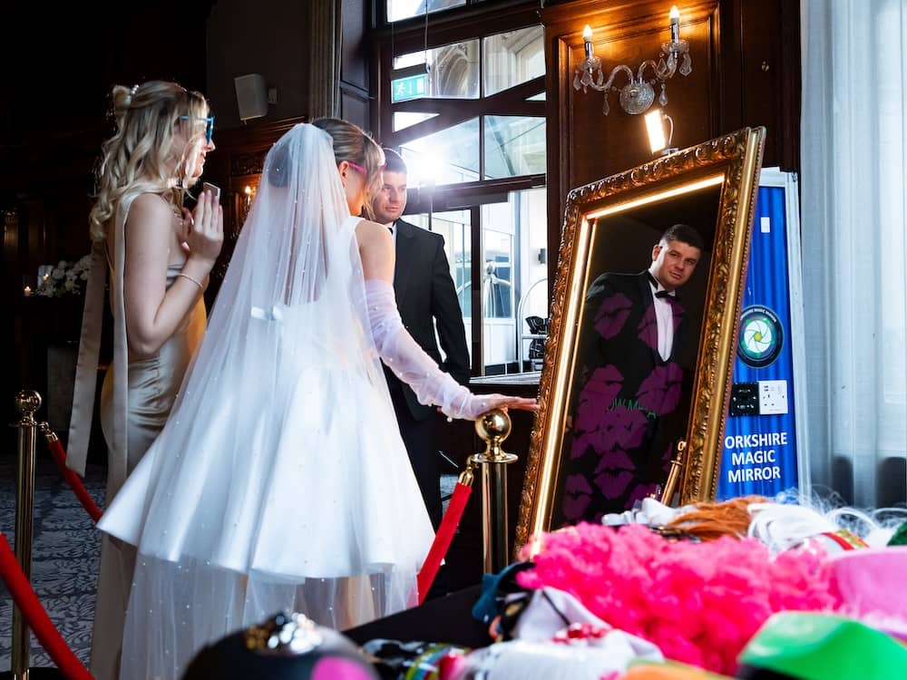 Bride discovering the Magic Mirror at a wedding reception