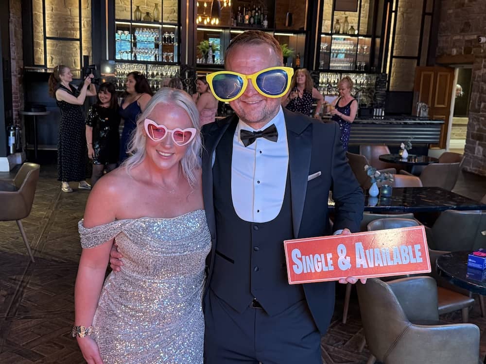 Guests wearing oversized glasses at Julie Scanlon's birthday party
