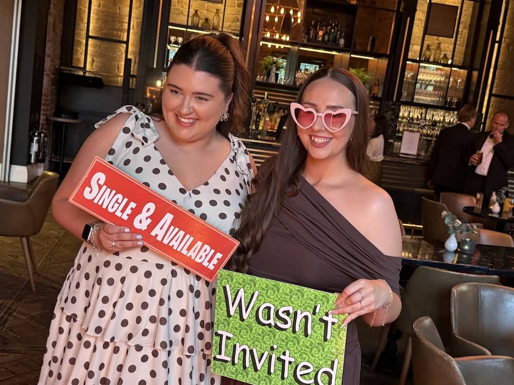 Guests with novelty signs at Manor House Lindley