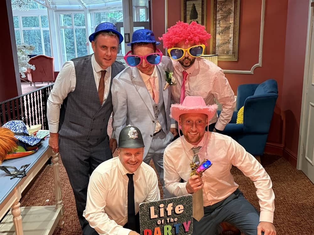 Group of friends posing with the Magic Mirror
