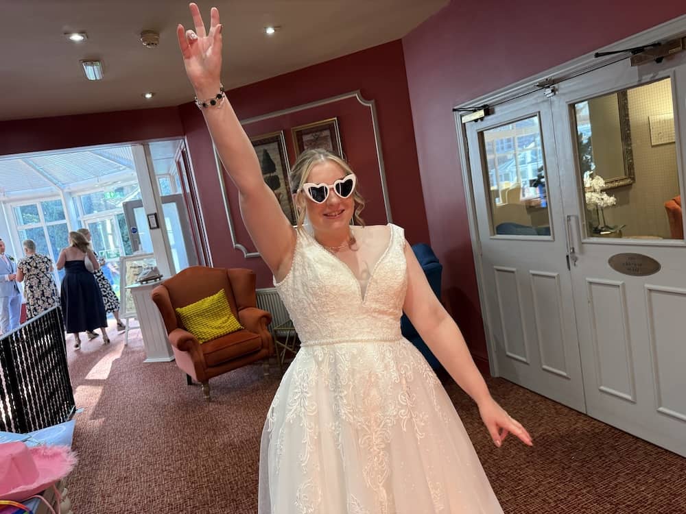 Lizzie celebrating in front of the Magic Mirror