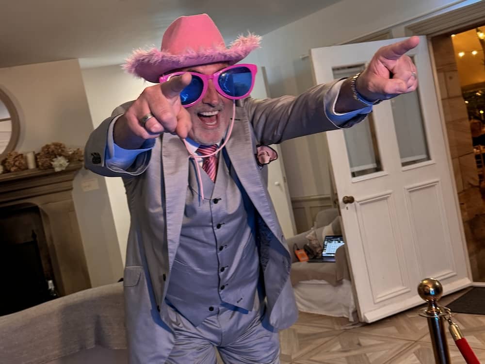 Older wedding guest enjoying the Magic Mirror