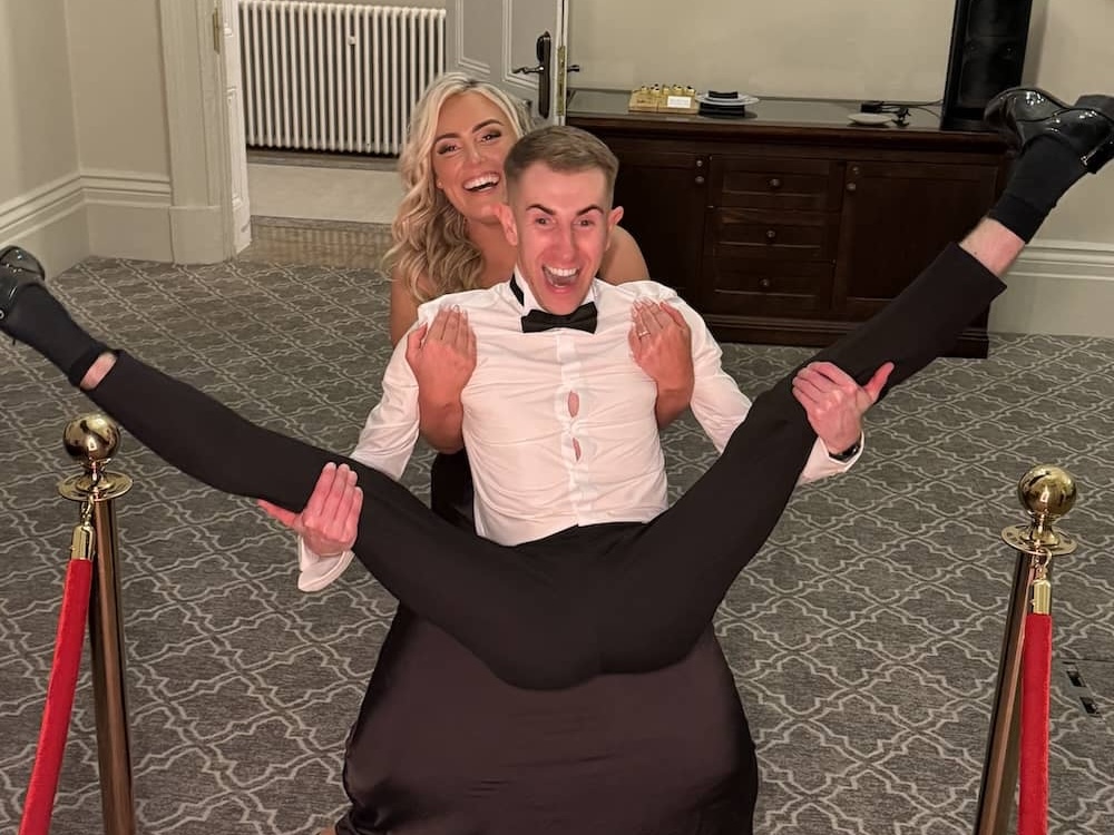 Wedding guests attempting the splits in front of the Magic Mirror