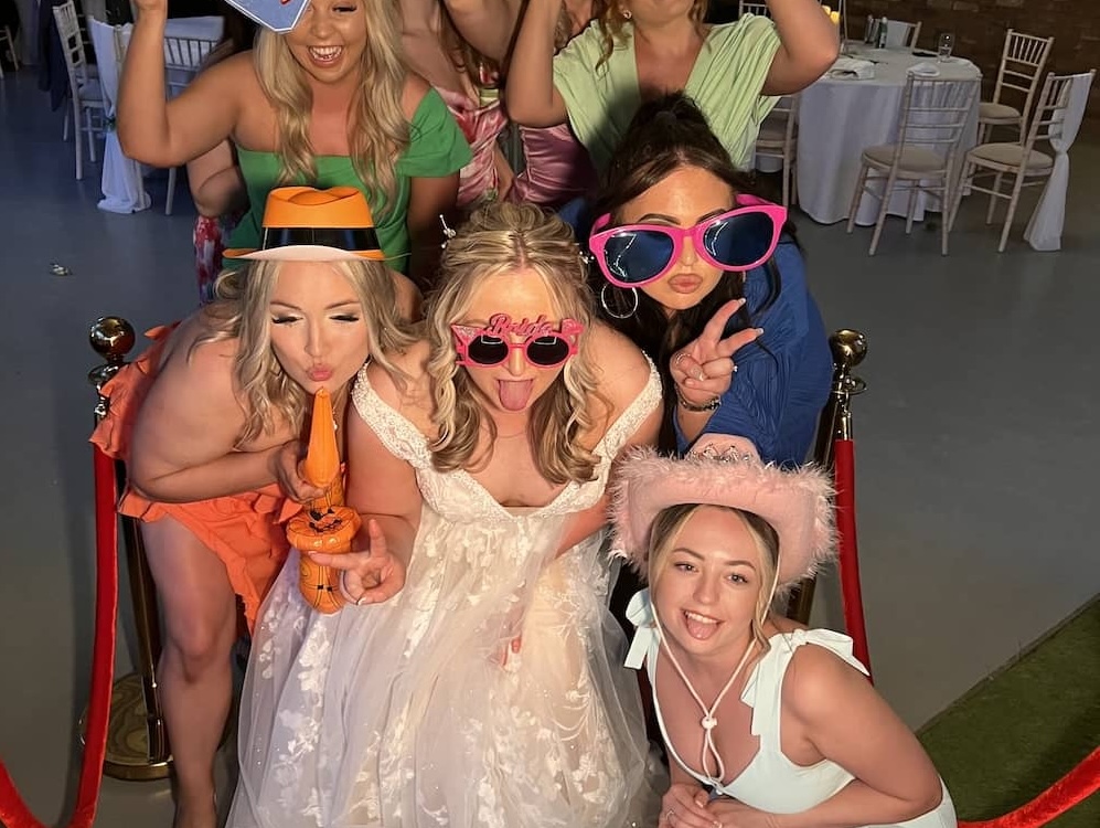 Wedding guests having fun and striking crazy poses at the Yorkshire Magic Mirror