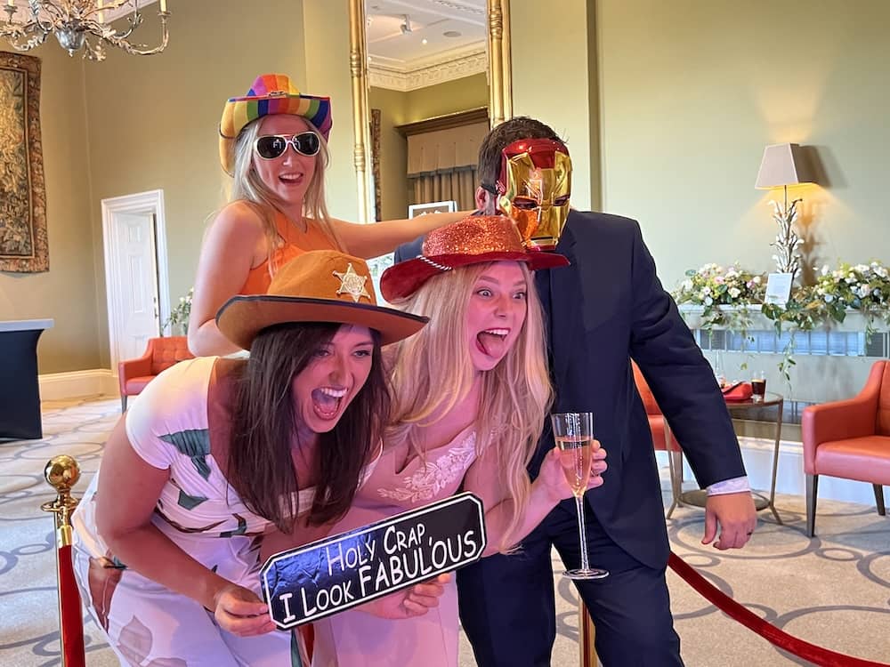 Wedding guests dressed as cowgirls and Ironman at Rudding Park Magic Mirror