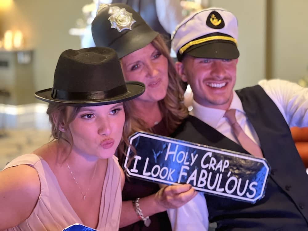 Guests taking selfie style photo beside Magic Mirror at Rudding Park