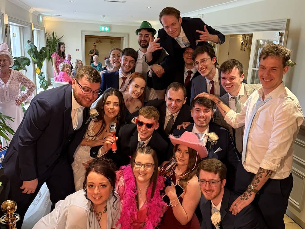 Wedding guests group photo at Magic Mirror