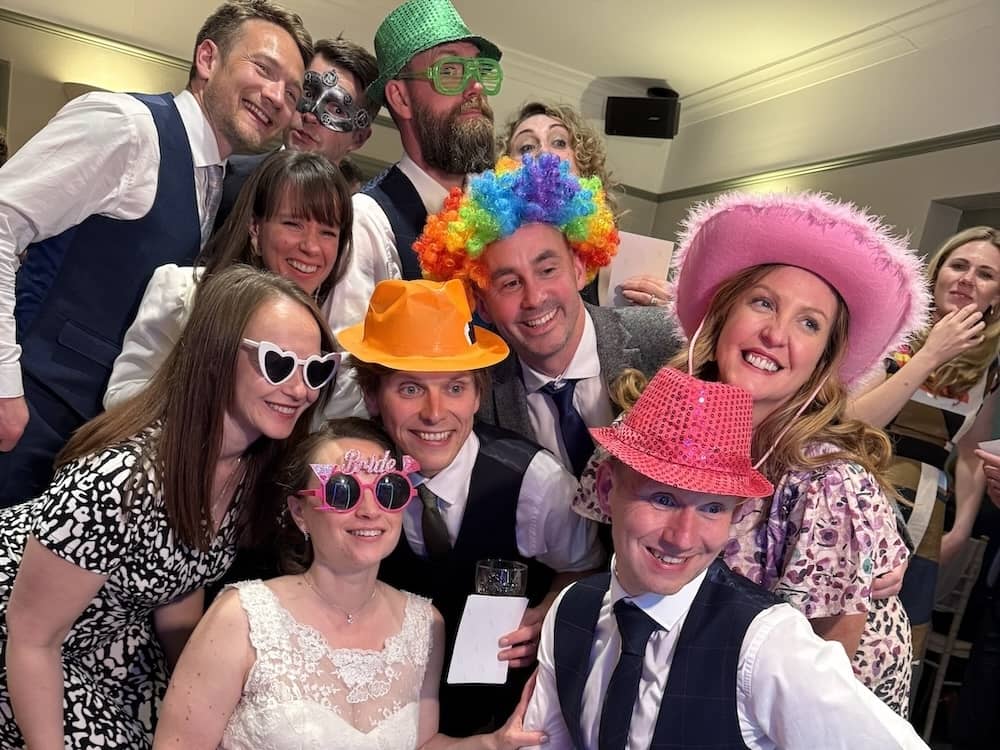 Wedding party using the photo booth at Chevin Country Park Hotel & Spa