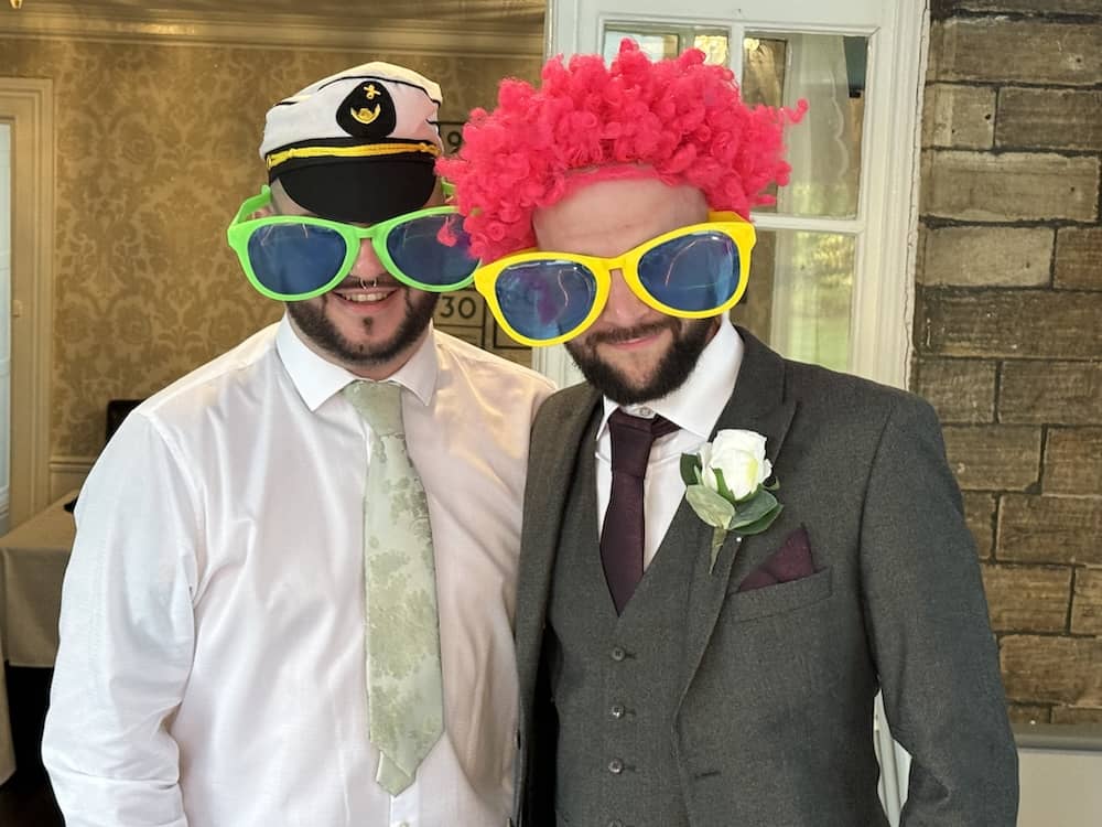 Wedding guests using Magic Mirror props at Dimplewell Lodge