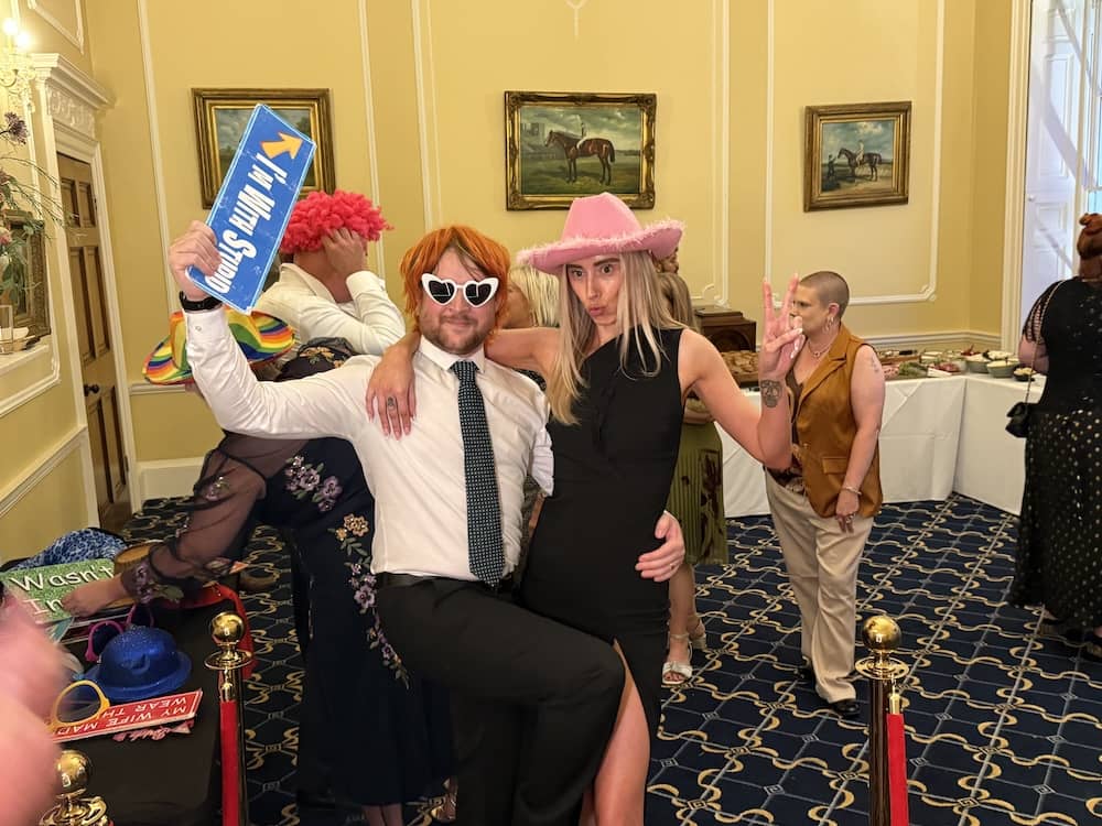 Wedding guests using props at the Magic Mirror at Owston Hall