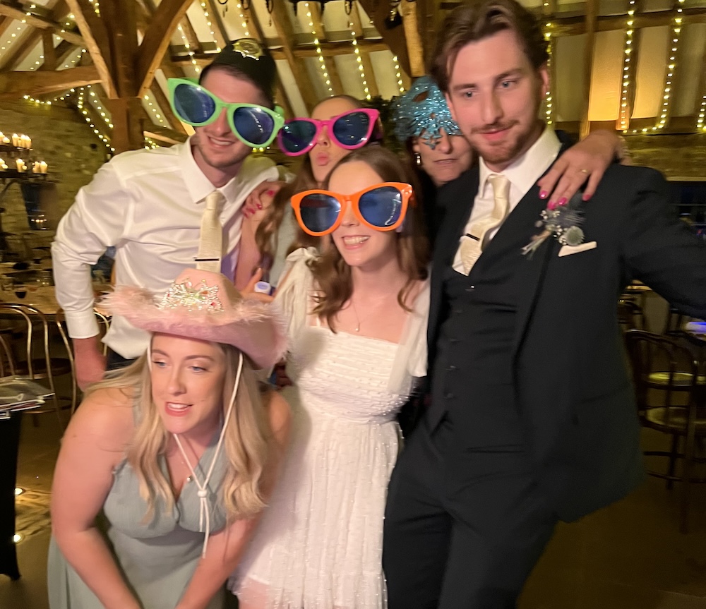 Wedding guests enjoying the Magic Mirror at The Tithe Barn