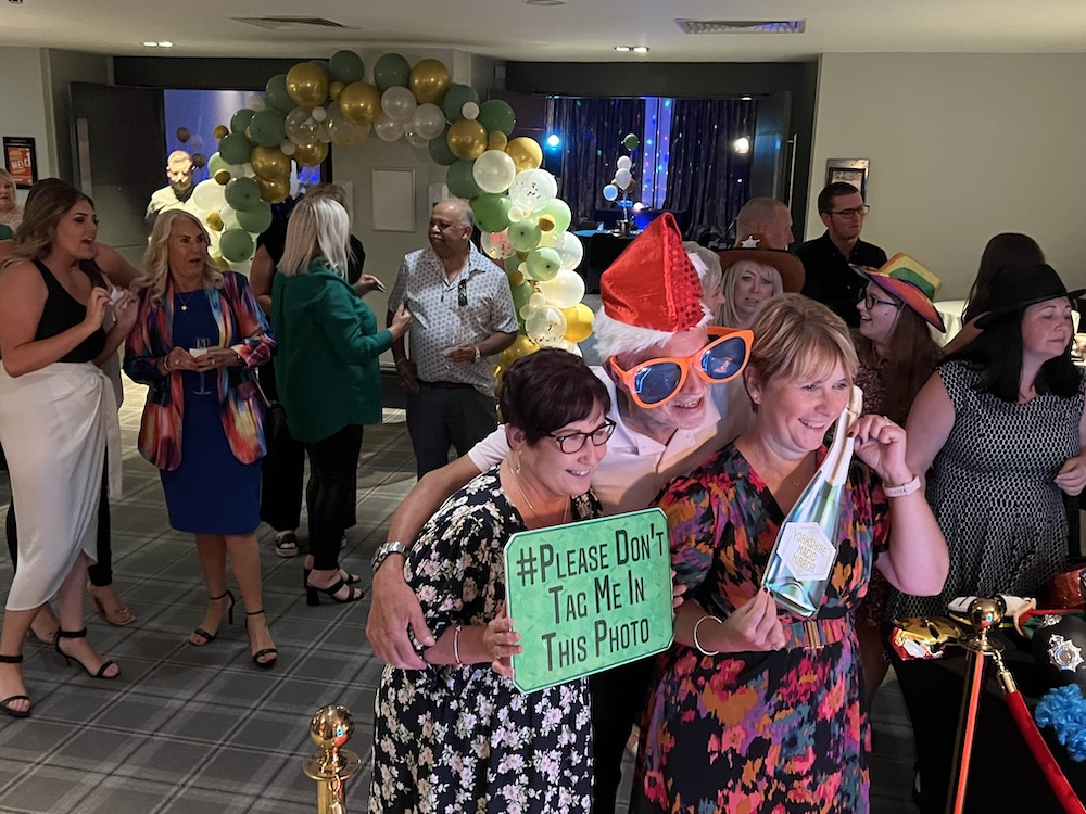 Wedding guests interacting with the Magic Mirror at Village Hotel Leeds South